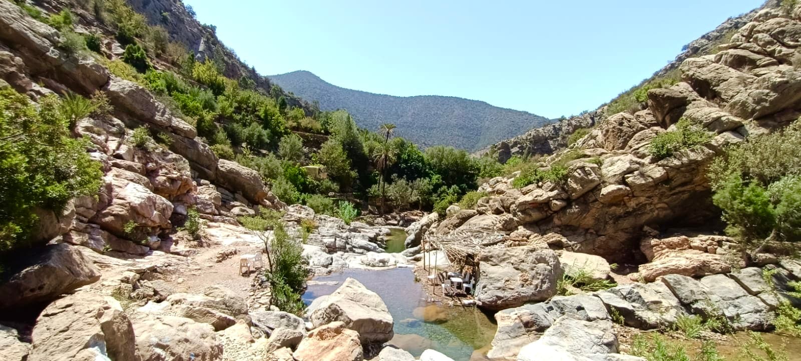 A rocky canyon gorge opening onto distant mountains in Paradise Valley