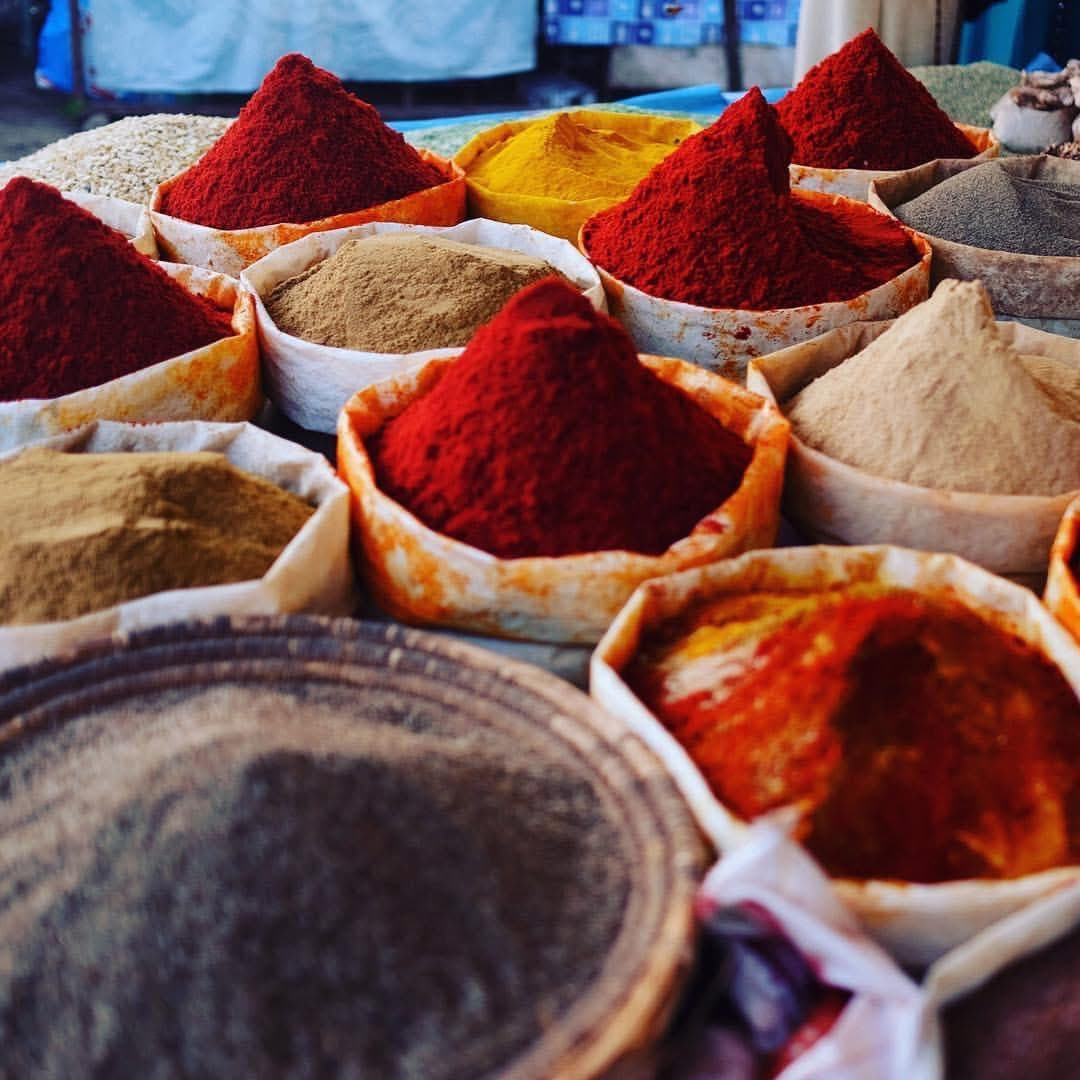 Vivid cones of spices for sale at a Moroccan souk
